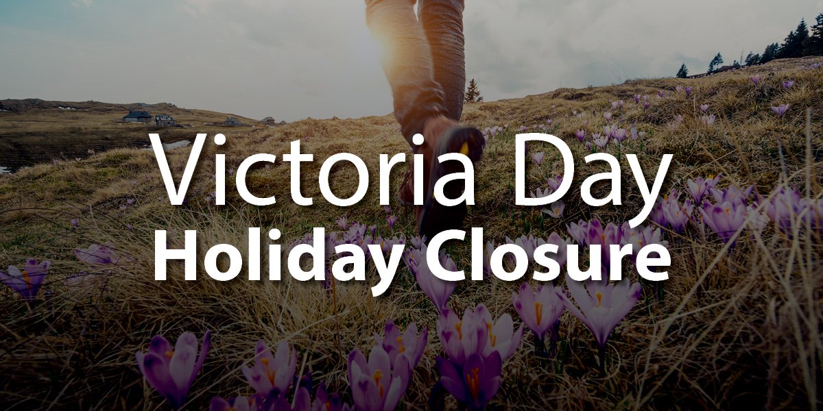Background of a field with purple flowers and text "Victoria Day Holiday Closure"