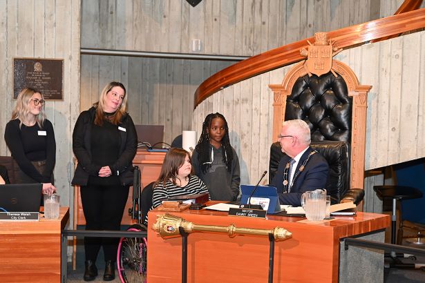 Mayor Breen with St. John's staff, Onashe (Pearl) Oghenekeevwe, and Caci (Casey) Ebsary