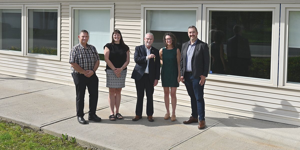 From left to right, Councillor Ron Ellsworth; Deputy Mayor Sheilagh O’Leary; Mayor Danny Breen; Laura Winters, CEO, Stella’s Circle; Joshua Smee, CEO of Food First NL at 77 Charter Ave for the official key handover. 