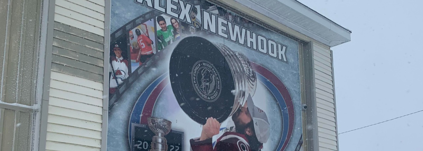 portion of mural featuring Alex Newhook kissing the Stanley Cup