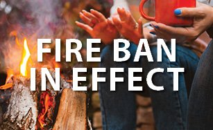 Image of a fire with white text "Fire Ban in Effect"