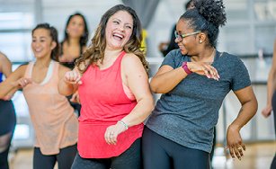 people participating in a fitness class. 