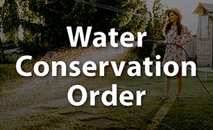 person watering their lawn and includes text Water Conservation Order